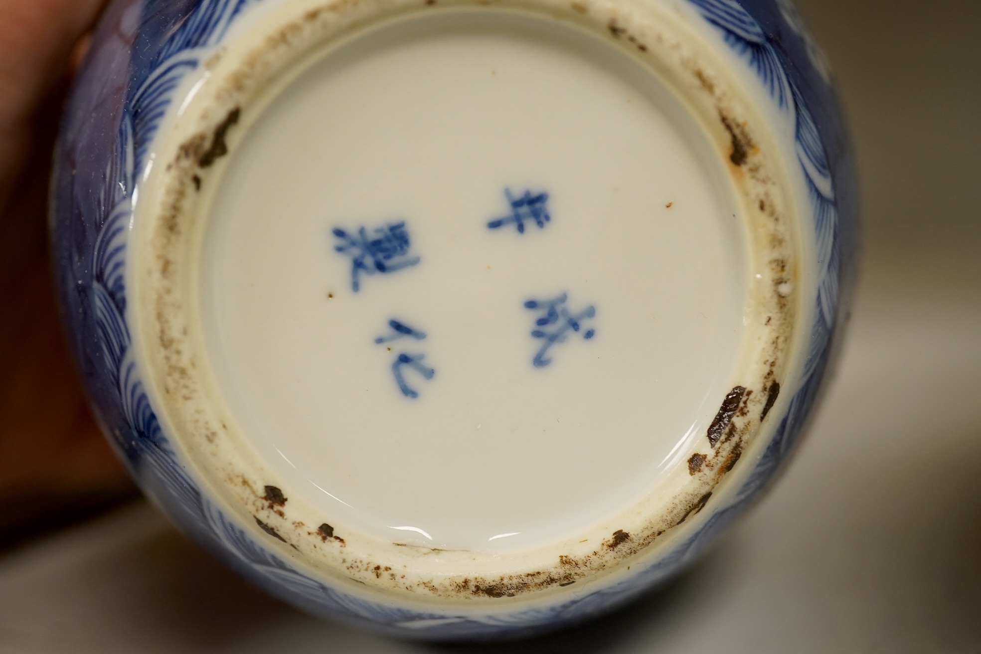 A Chinese powder blue bowl, early 18th century and a Chinese blue and white prunus jar - tallest 13cm. Condition - fair